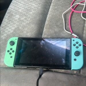 Nintendo Handheld Console in Green and Blue with Detachable Joy-Con Controllers